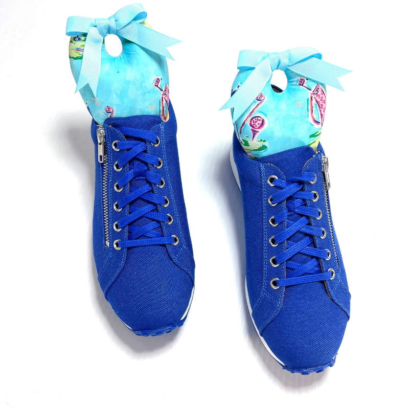 Golf Shoe Stuffers inside blue trainers with ribbon accents, stylish and practical for shoe maintenance and storage.