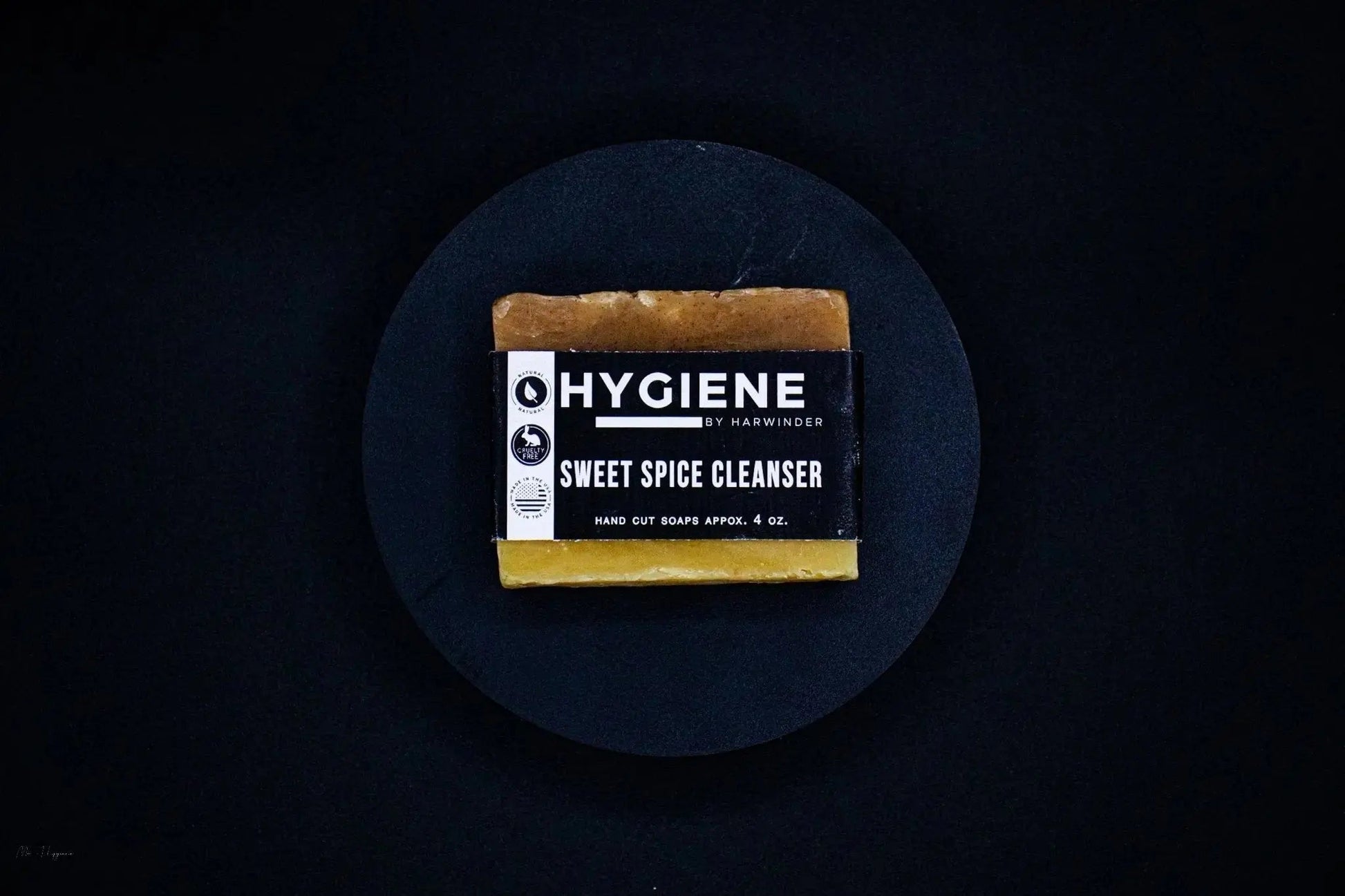 Bar of Sweet Spice Cleanser Luxury Mens Soap with black label on dark background