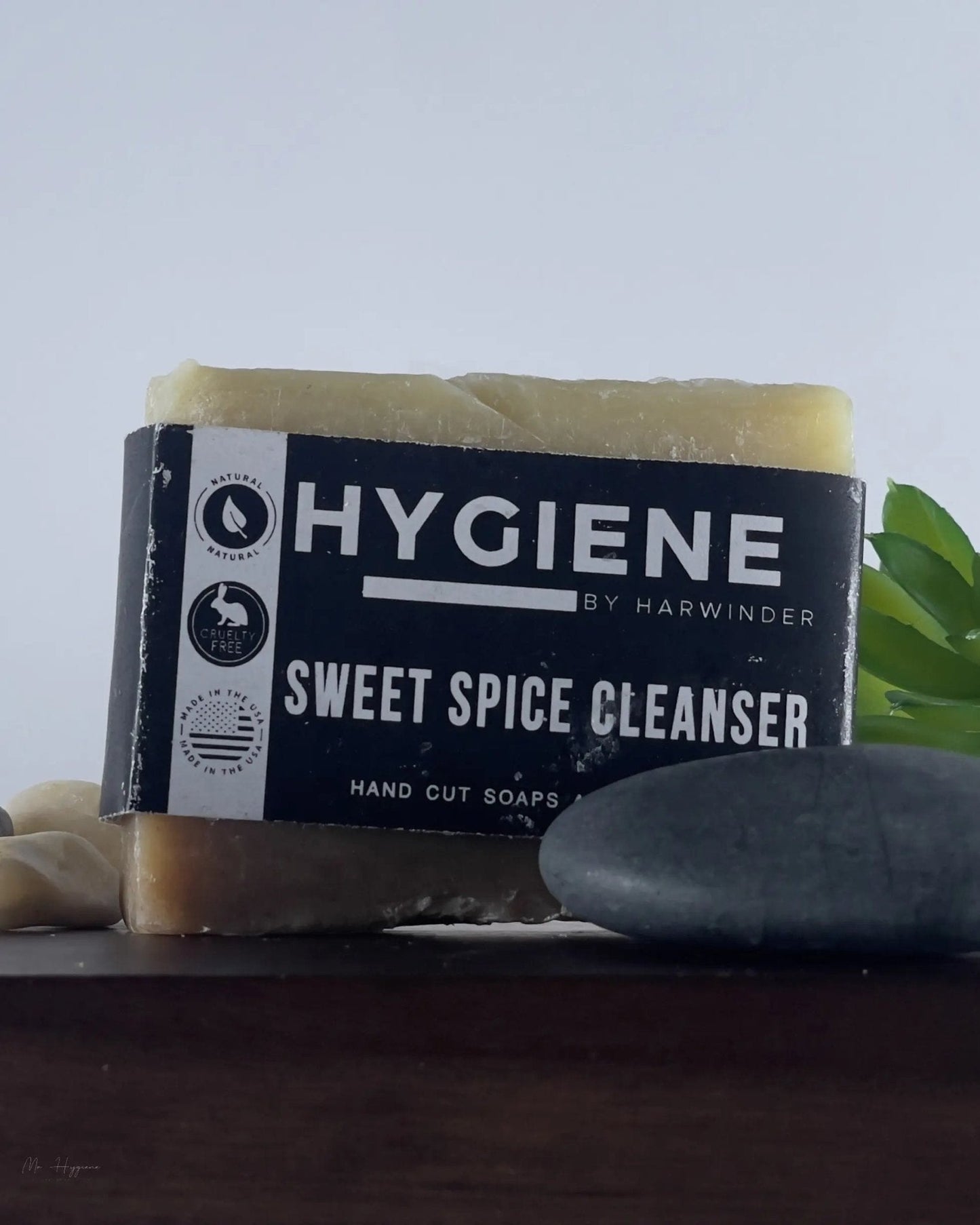 Sweet Spice Cleanser Luxury Mens Soap on display with fresh herb accents