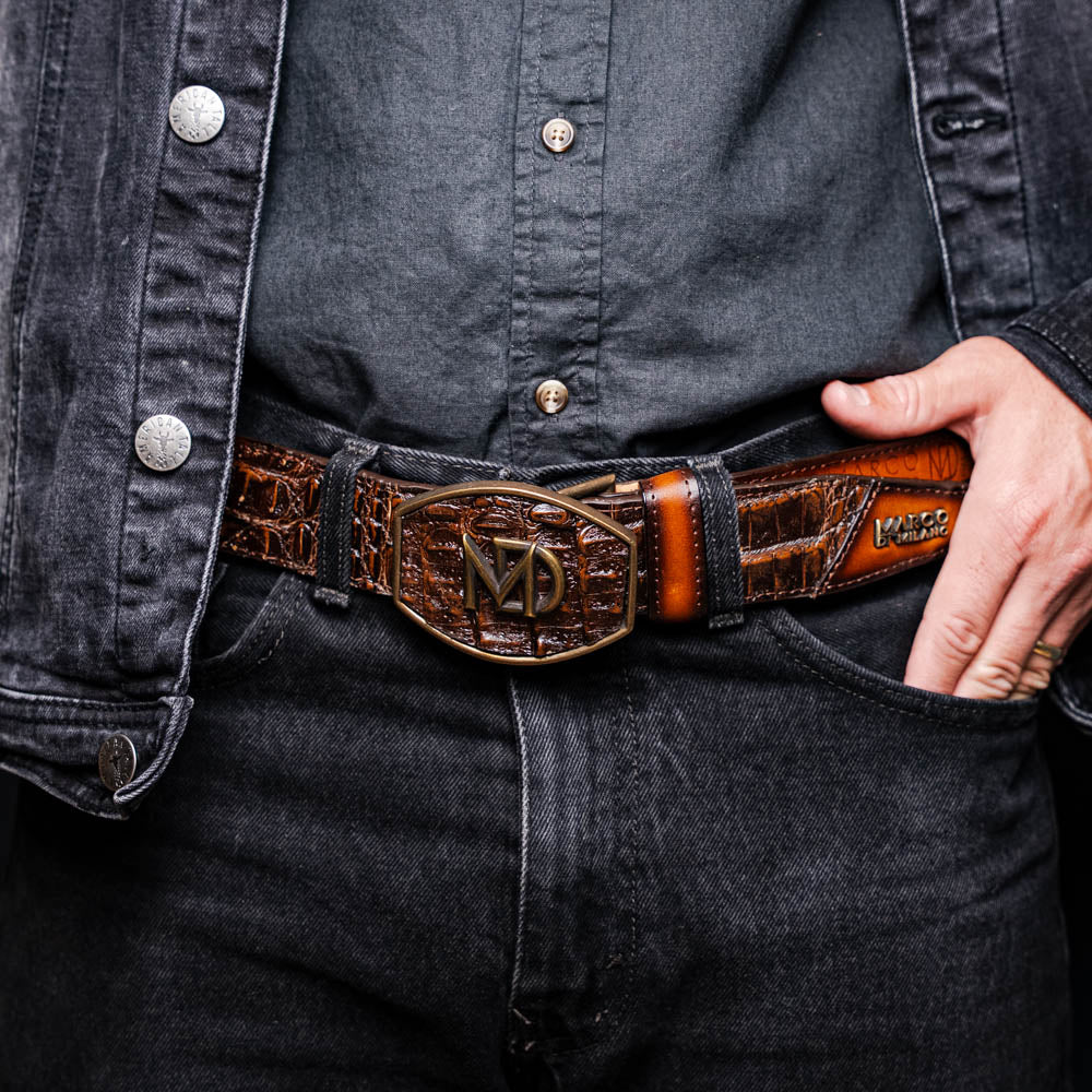 Texas Belt Aged Brown with caiman and calfskin leather featuring Marco Di Milano branding worn with jeans and jacket