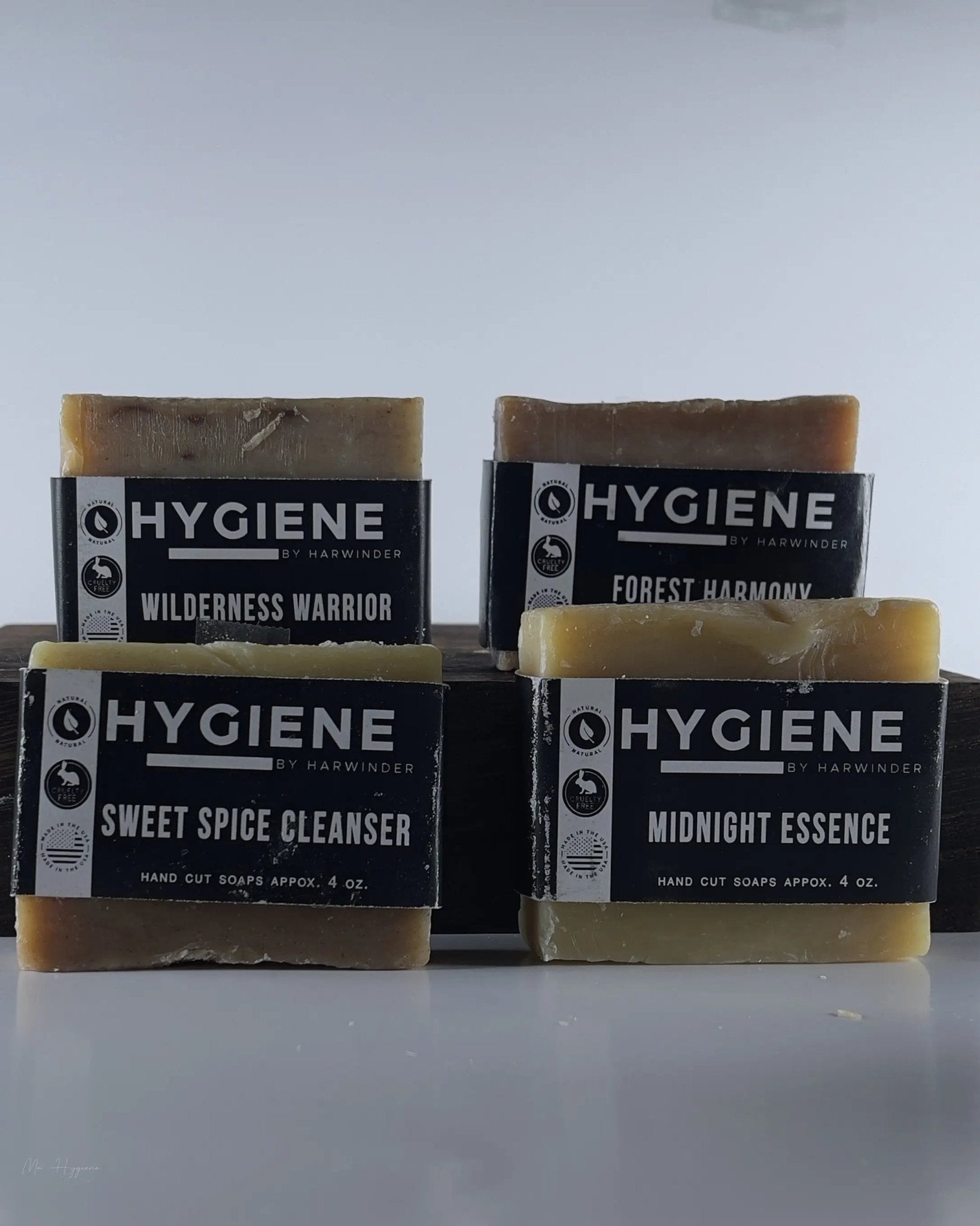 Premium Natural Bar Soap Collection for Men featuring Wilderness Warrior, Forest Harmony, Sweet Spice Cleanser, and Midnight Essence.