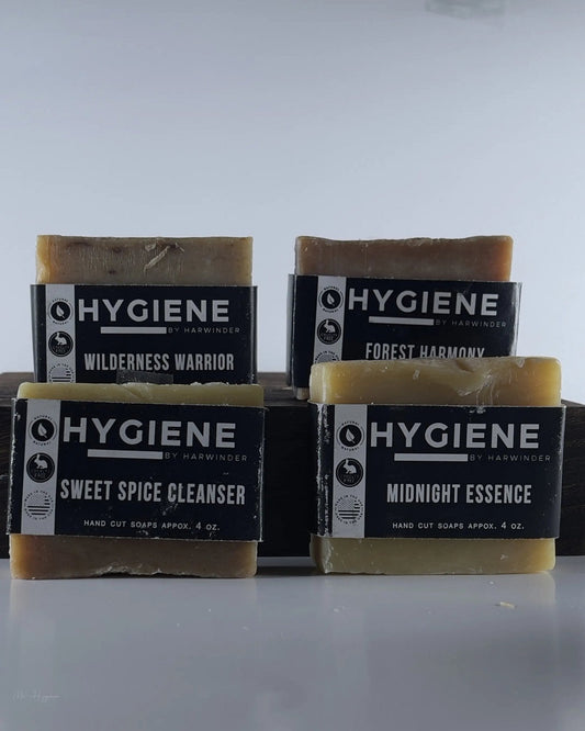 Premium Natural Bar Soap Collection for Men featuring Wilderness Warrior, Forest Harmony, Sweet Spice Cleanser, and Midnight Essence.