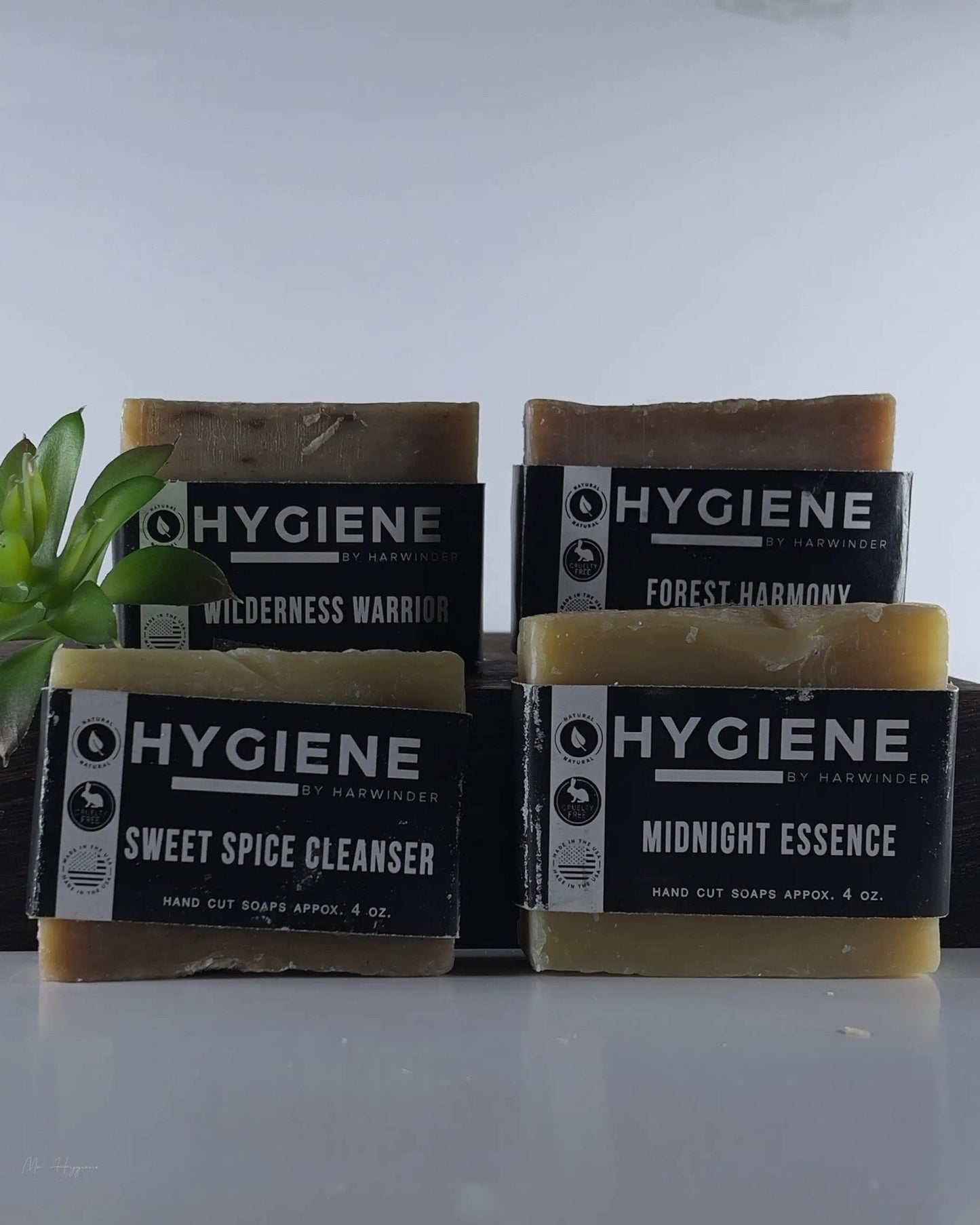 Premium Natural Bar Soap Collection for Men featuring sweet spice, wilderness, forest, and midnight essence soaps displayed elegantly.
