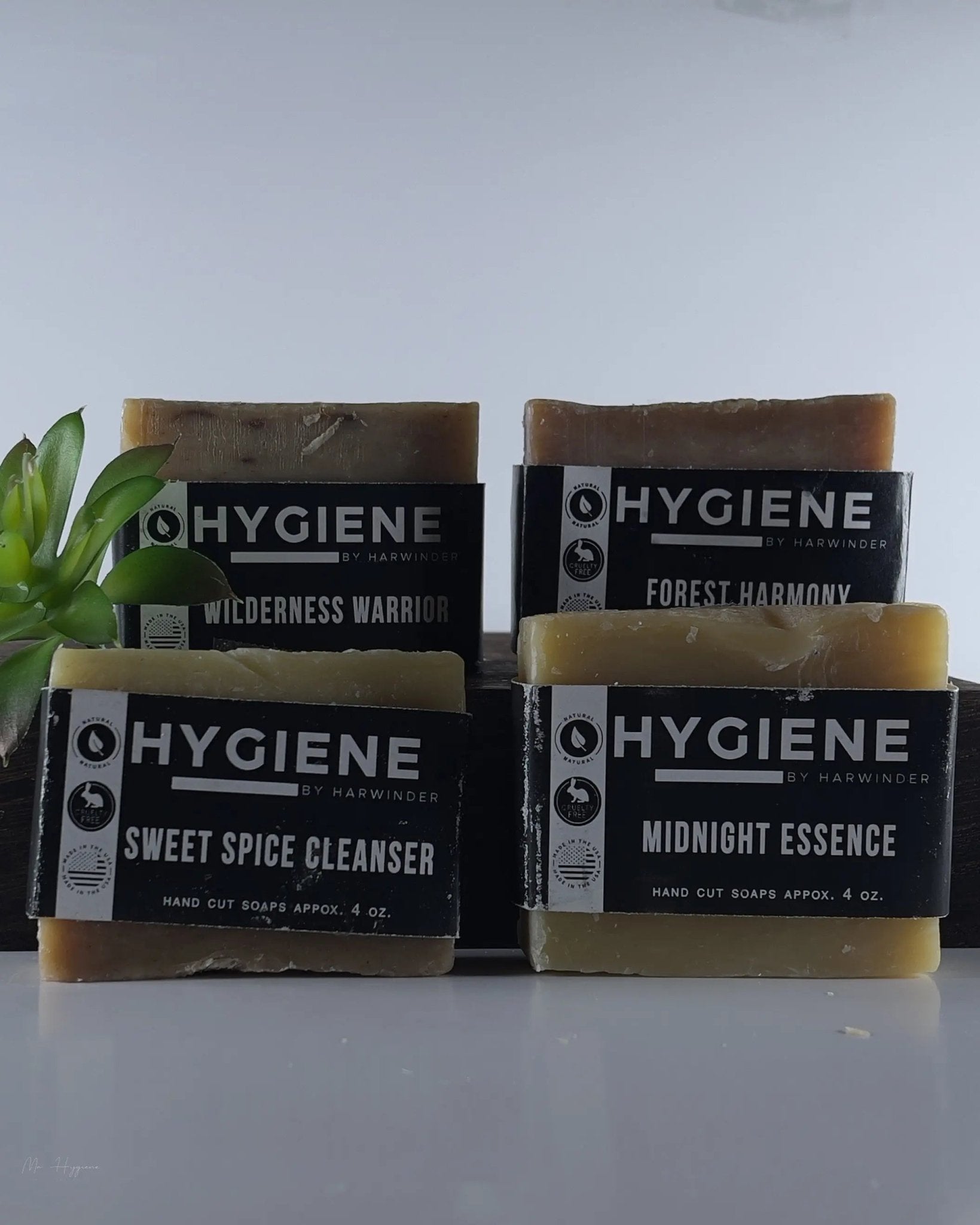 Premium Natural Bar Soap Collection for Men featuring sweet spice, wilderness, forest, and midnight essence soaps displayed elegantly.