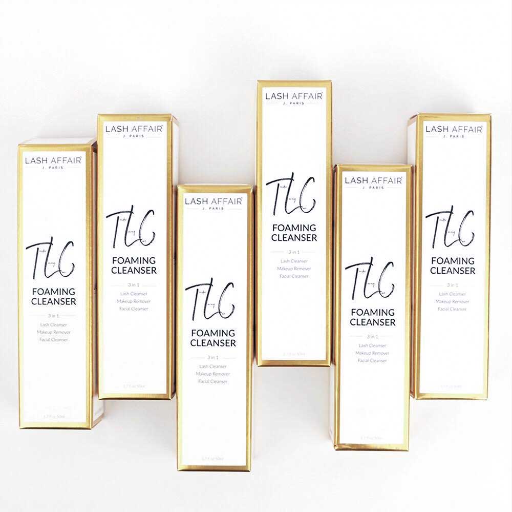 TLC | Tea Tree 3-in-1 Eyelash Extension Cleaner boxes arranged in a display, showcasing lash care and antibacterial properties.