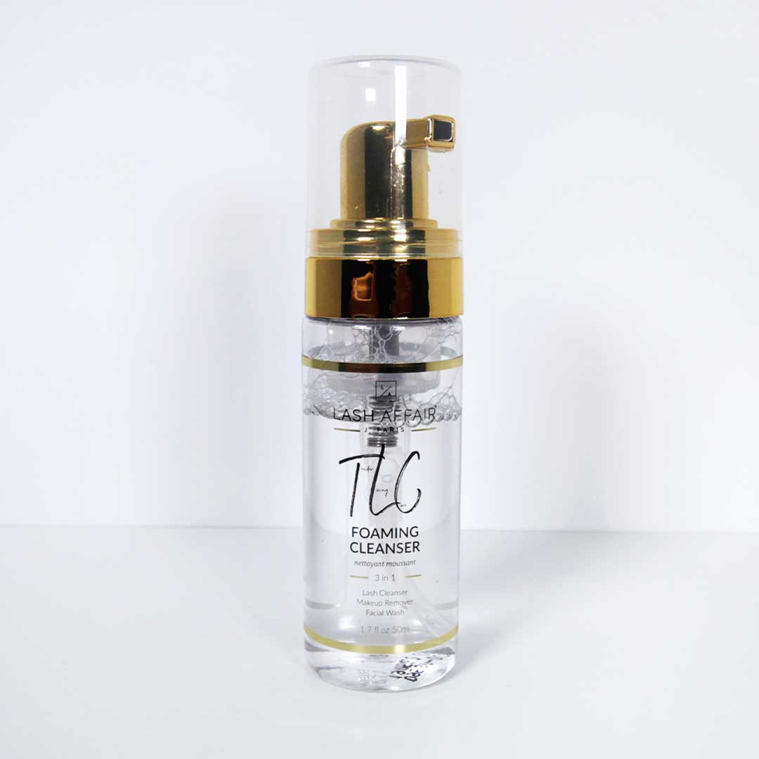 TLC | Tea Tree 3-in-1 Eyelash Extension Cleaner in a sleek bottle with a gold pump dispenser.