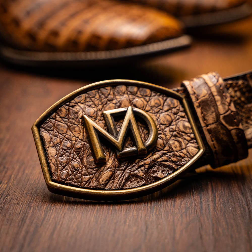 Tucson Stone Brown genuine caiman belly cowboy boot with Western design belt buckle.