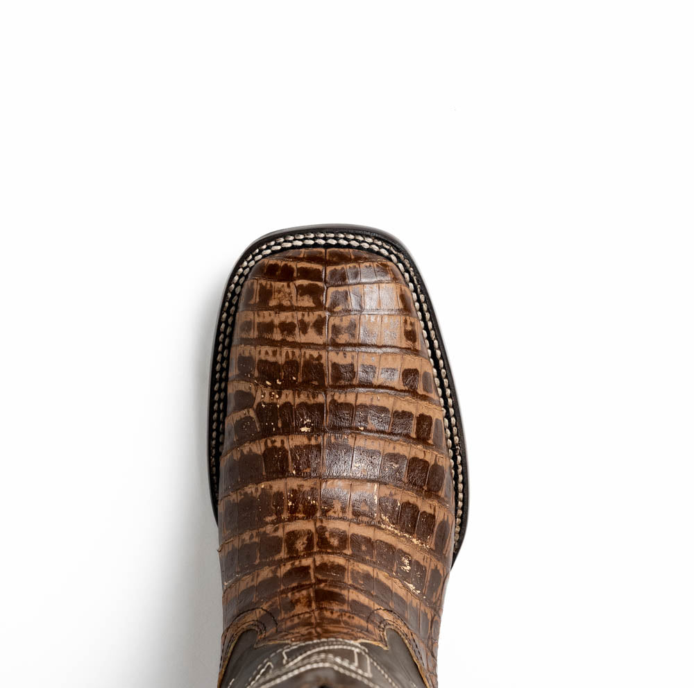 Close-up of a Tucson Stone Brown cowboy boot with genuine caiman belly skin, showcasing square-toe design and Western sophistication.