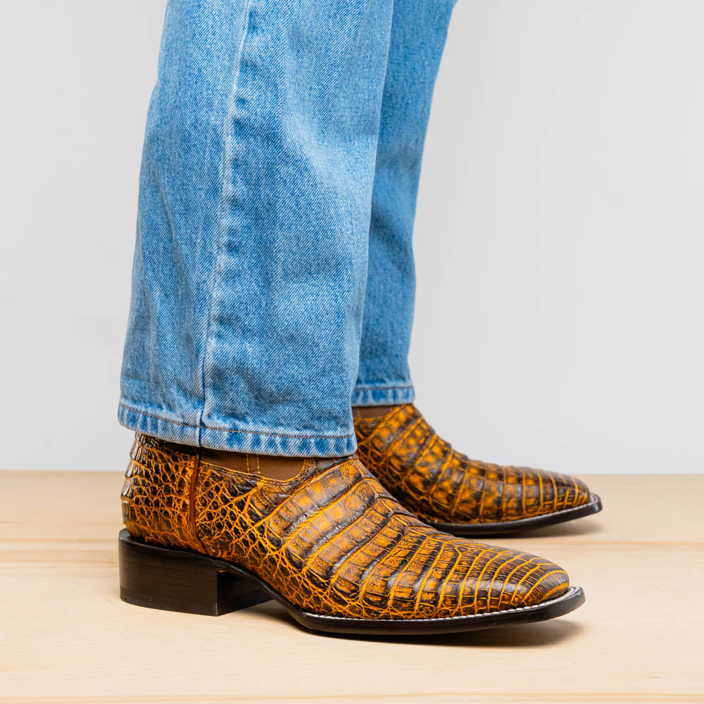 Tucson Mustard Brown cowboy boot in caiman belly skin, showcasing Western style with a bold square-toe profile.