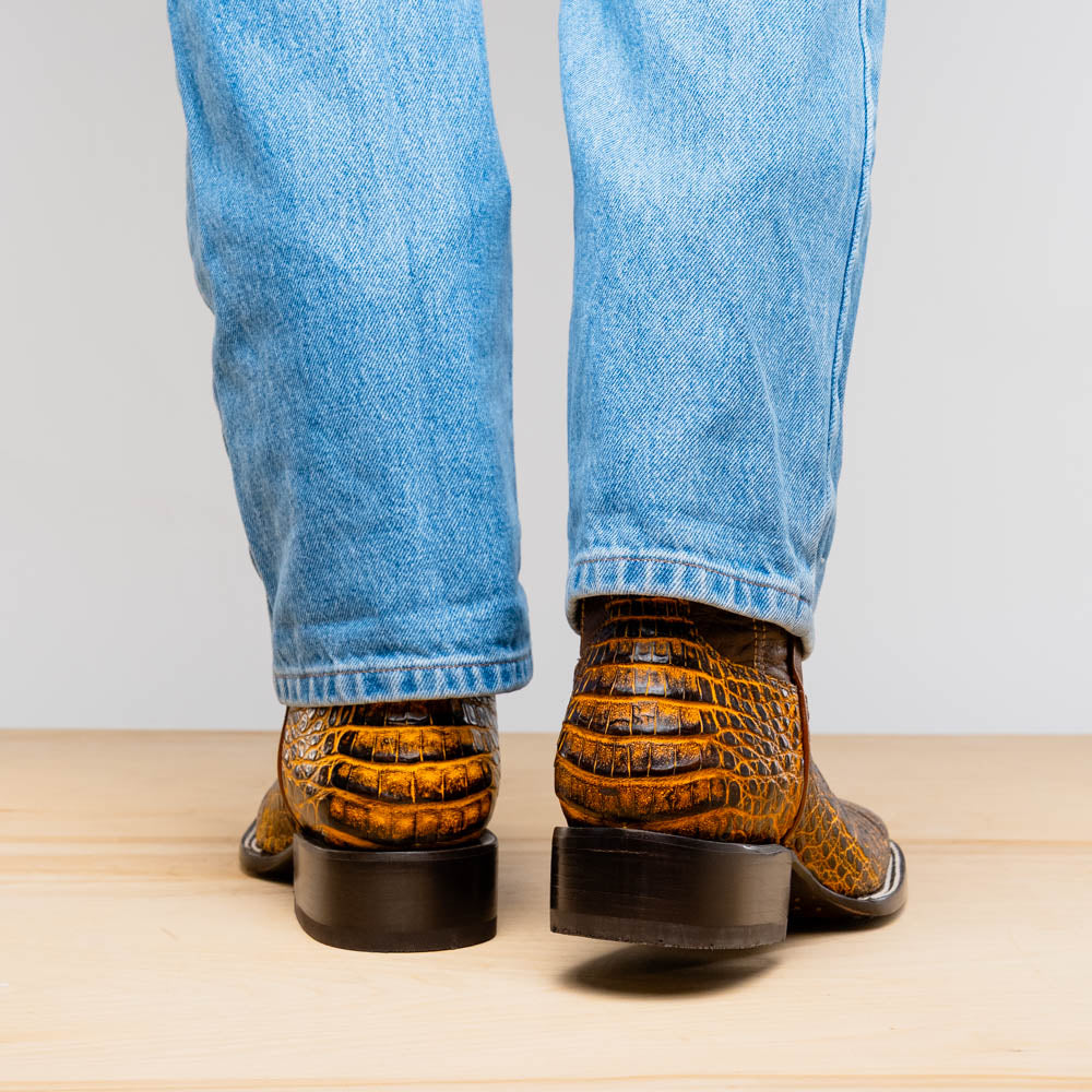 Tucson Mustard Brown caiman belly skin cowboy boots viewed from the back, showcasing Western style craftsmanship.