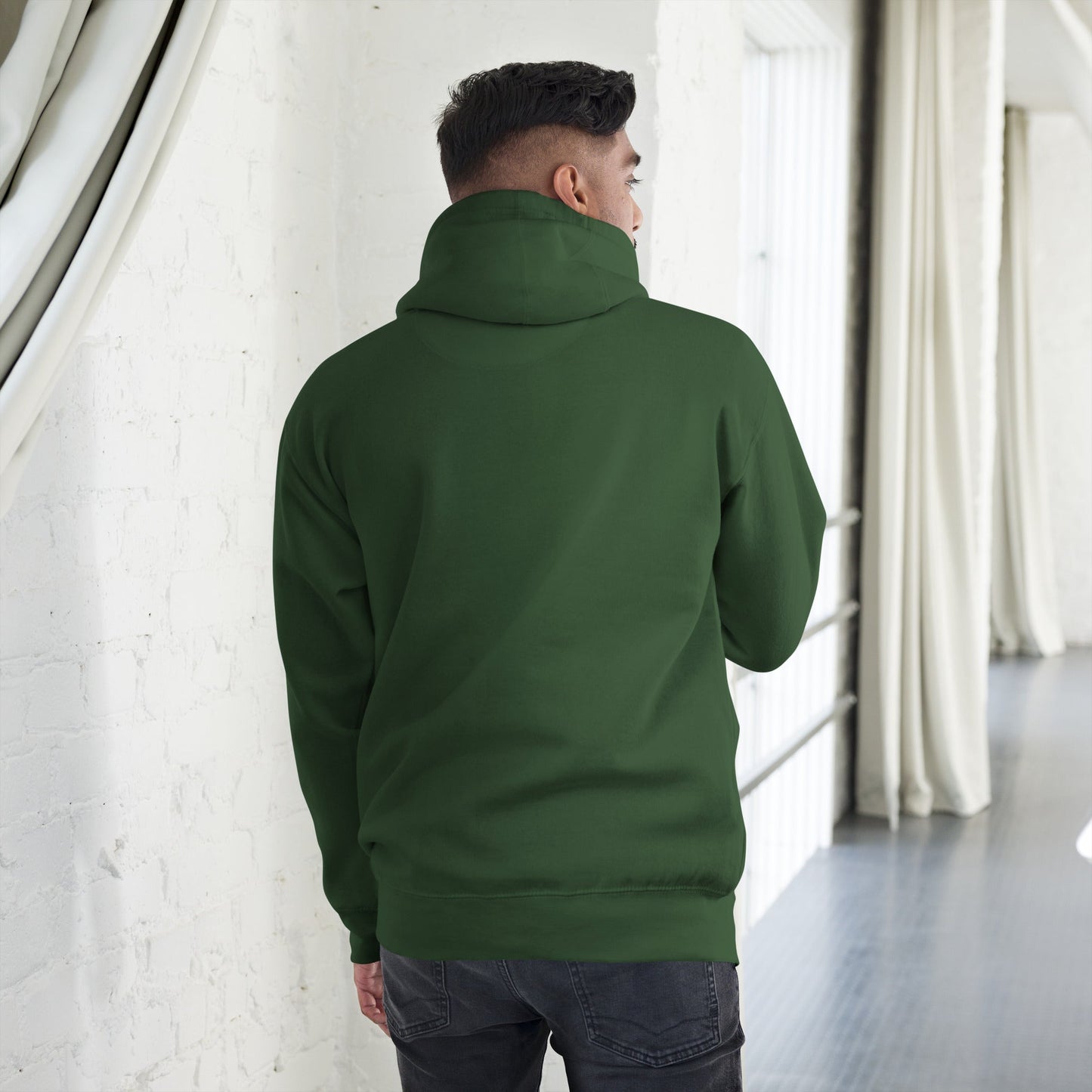 Back view of model wearing Men’s Green Smile Hoodie – Trendy & Comfortable Streetwear with a Fun Twist in a spacious room.