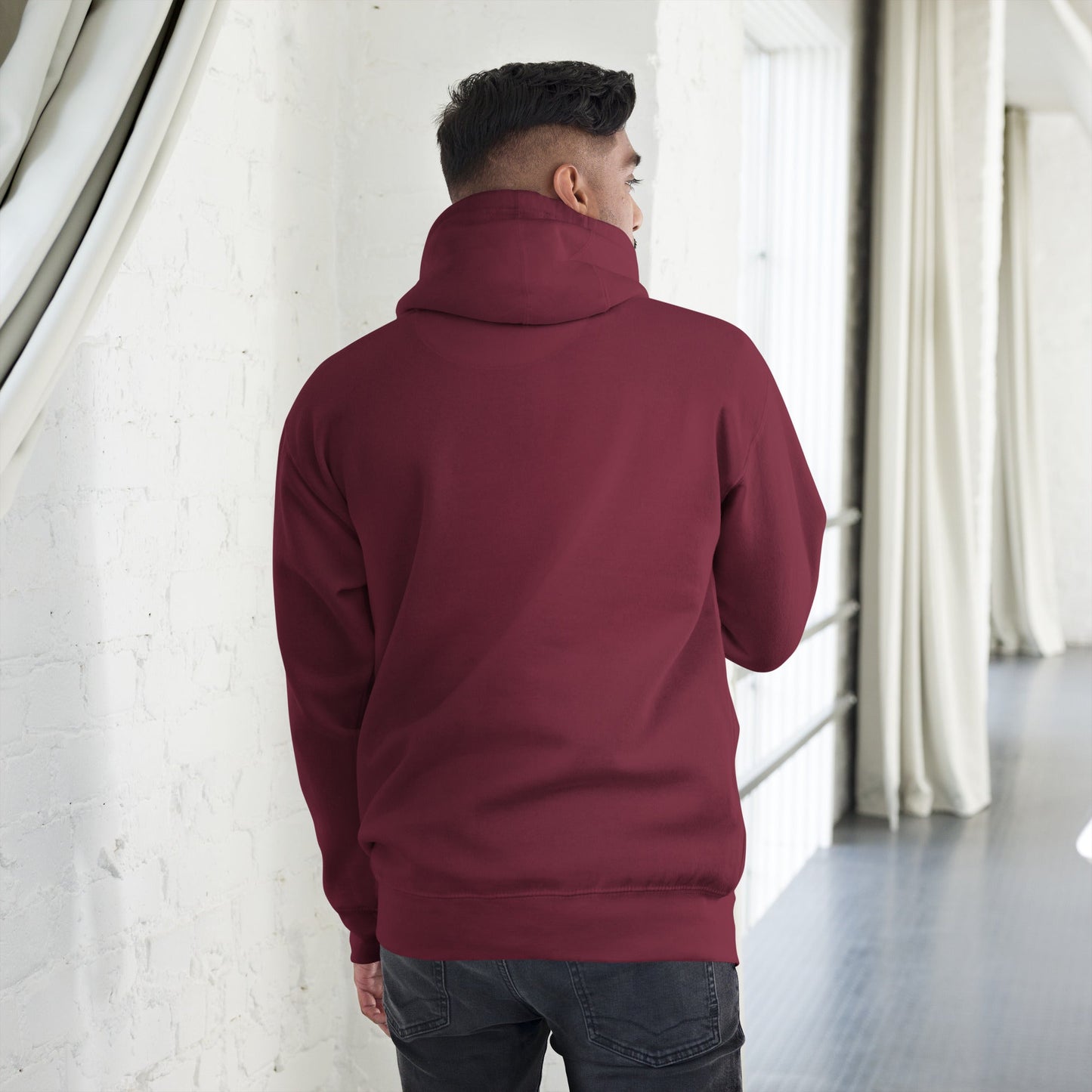 Back view of a man wearing a Men’s Green Smile Hoodie – Trendy & Comfortable Streetwear with a Fun Twist, standing indoors.