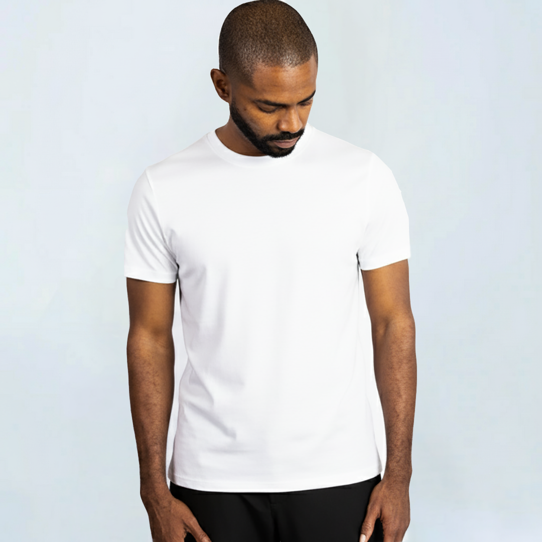Man wearing white Short Sleeve Perfect Tee made from premium Peruvian Pima cotton, showcasing comfort, wrinkle resistance, and moisture-wicking properties.