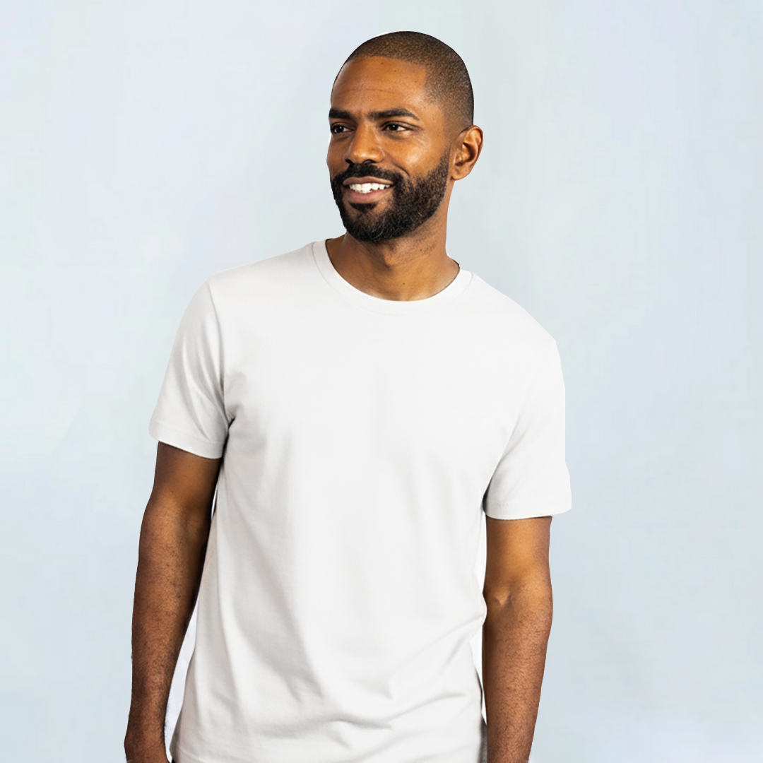 Man wearing Short Sleeve Perfect Tee made from Peruvian Pima cotton, showcasing soft, wrinkle-resistant fabric in white.