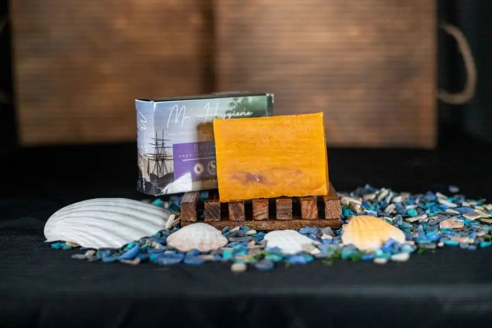 Bay Rum Mens Soap – Classic Scent, Modern Clean bar beautifully displayed with seashells and pebbles.