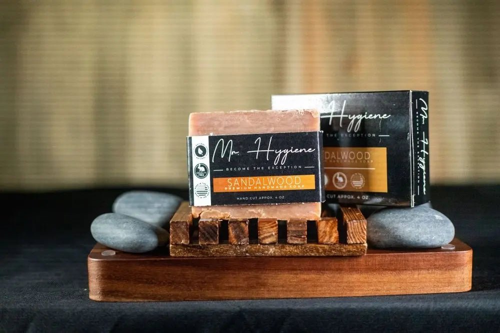 Sandalwood Bar Soap – Classic Scent, Deep Clean displayed on wooden tray with stones, ideal for environmentally friendly grooming.