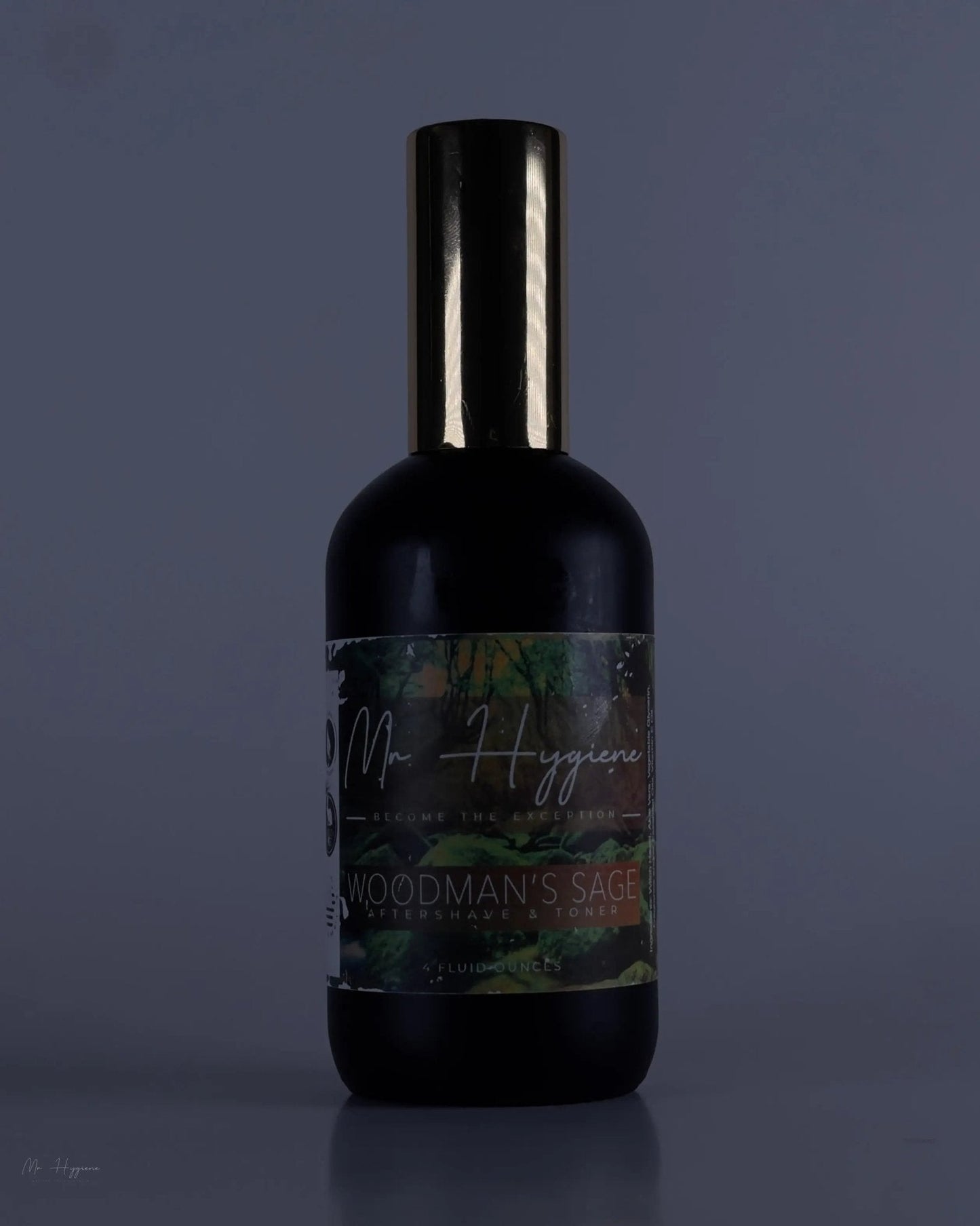 Bottle of Woodman's Sage Mens Aftershave & Toner with dark label and sleek design.